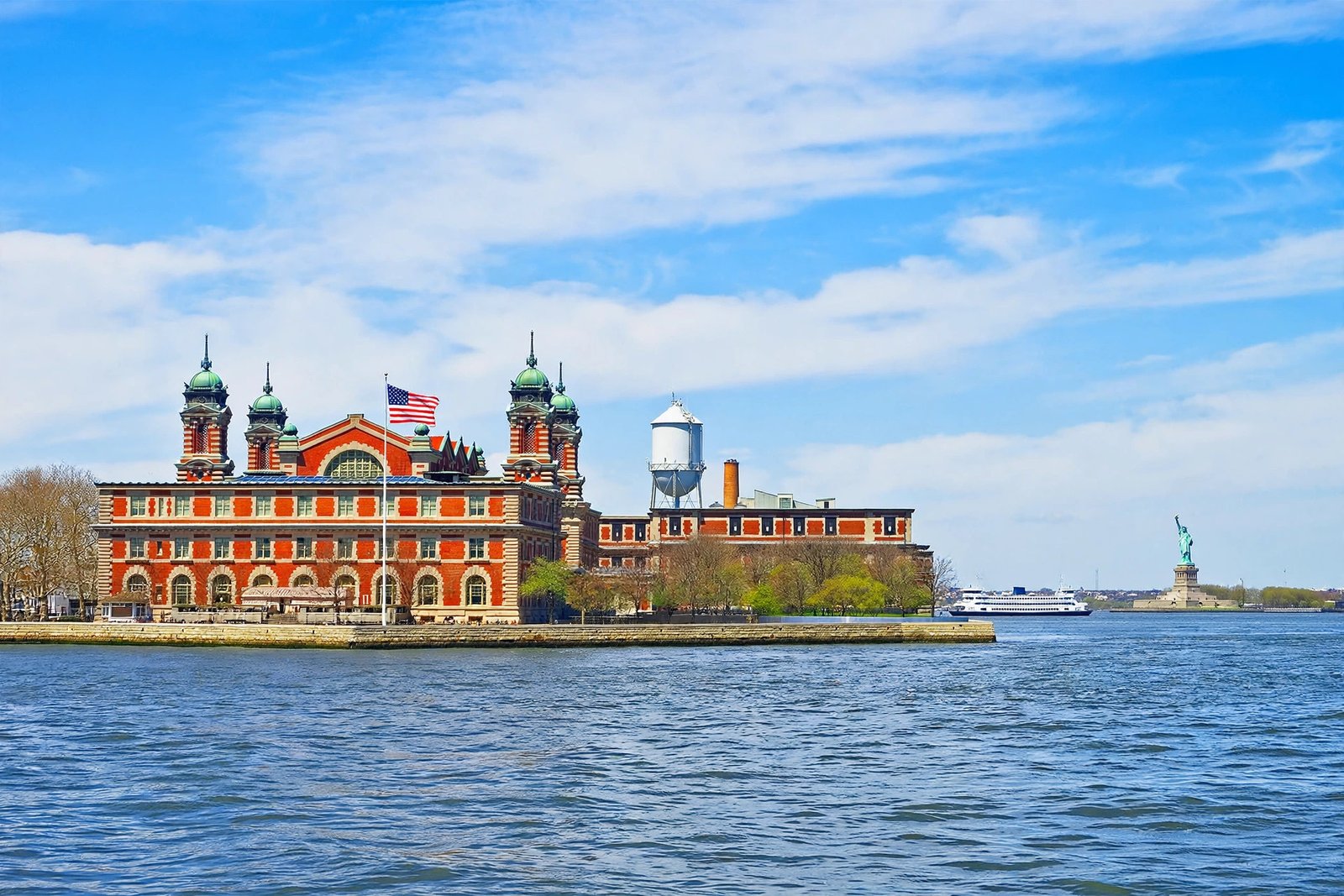 Historic Ellis Island main building in New York Harbor on a sunny day
